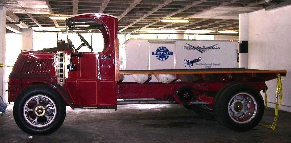 1920s Mack AC delivery truck (Bulldog), with chain drive and solid rubber tires.